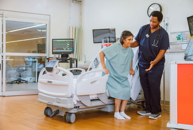 nurse-assisting-patient-out-of-bed